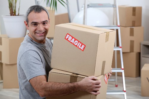 Loading furniture into a van for transport in Dagenham