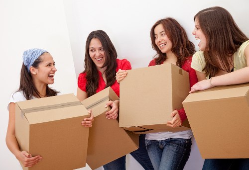 Packed boxes and furniture ready for a removal van job