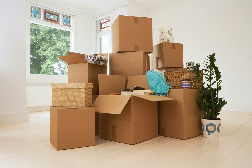 Removal team handling boxes and furniture for a local move
