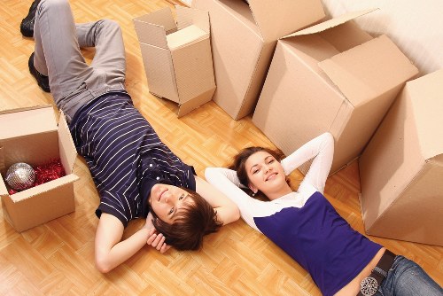 Team preparing an office move with labels and packing materials